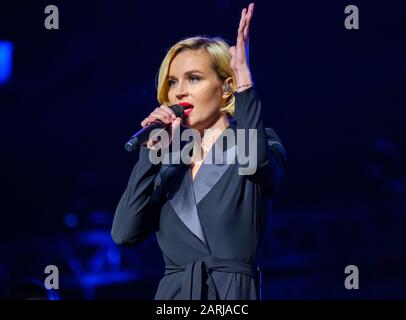 Famous Russian singer Polina Gagarina sings in front of participants in the business forum Stock Photo