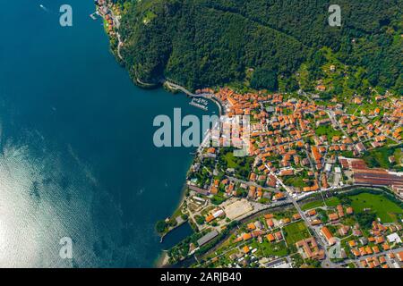 Aerial view of Como lake, Dongo, Italy. Coastline is washed by blue turquoise water Stock Photo