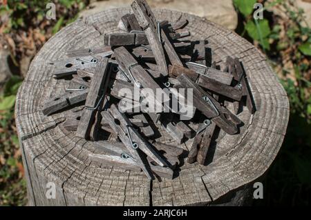 Pile of weathered wooden laundry clamps closeup Stock Photo
