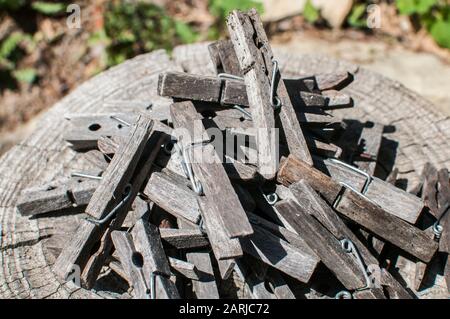 Pile of weathered wooden laundry clamps closeup Stock Photo