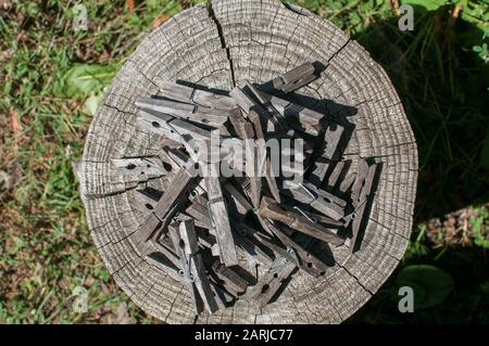 Pile of weathered wooden laundry clamps closeup Stock Photo
