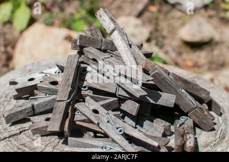 Pile of weathered wooden laundry clamps closeup Stock Photo