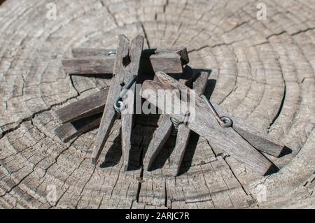 Pile of weathered wooden laundry clamps closeup Stock Photo