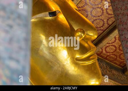 Photographing various elements of the golden statue of the Reclining Buddha is like creating separate pieces of art. Stock Photo