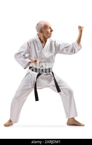 Full length shot of an elderly man practicing karate isolated on white background Stock Photo