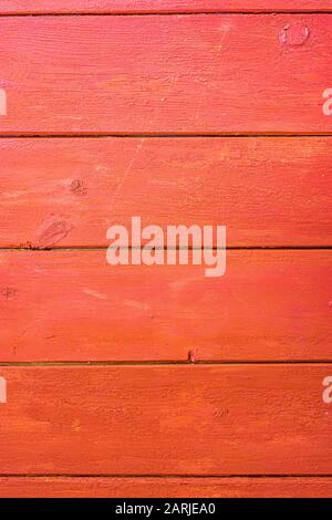 Old red painted board background. Wood panels on a rustic barn Stock Photo