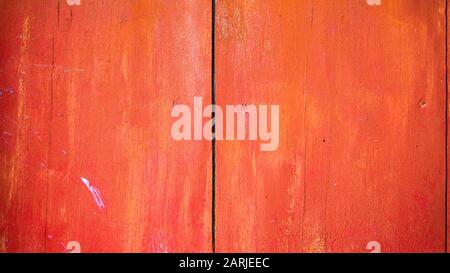 Old red painted board background. Wood panels on a rustic barn Stock Photo