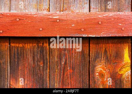Old red painted board background. Wood panels on a rustic barn Stock Photo