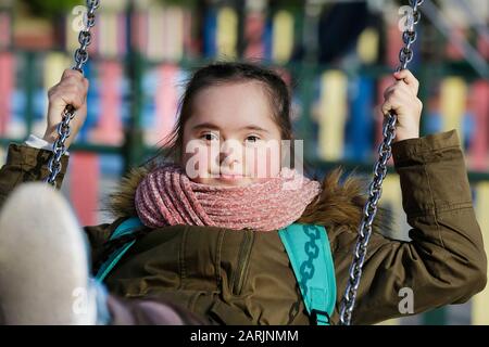 Nice girl having fun on the playground Stock Photo