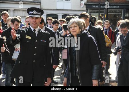 British Prime Minister, Theresa May, visiting Salisbury after the first Salisbury Russian Spy Poisoning Novichok incident in March 2018.  Welcomed by Wiltshire Police Chief Constable, Kier Pritchard and Salisbury MP, John Glen they visited The Mill pub, The Maltings Shopping Centre, and Zizzi restaurant. Stock Photo