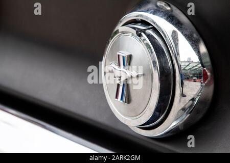 Ford Mustang logo on luxury classic car. Stock Photo