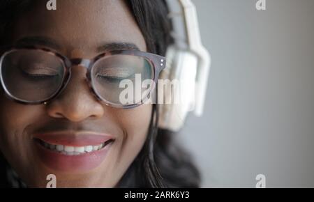 portrait of girl listening to music with headphones Stock Photo
