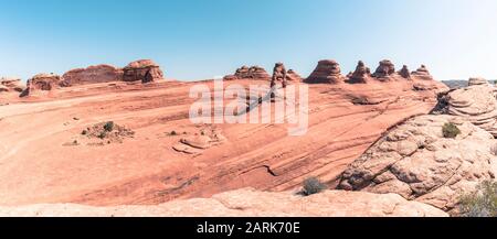 Panorama of Delicate Arch and surrounding peaks Stock Photo