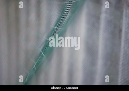 green mesh fence wave closeup, macro photo Stock Photo
