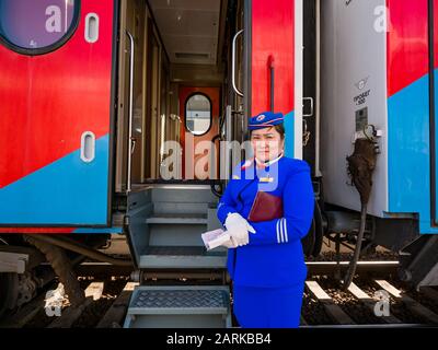 Stewardess in uniform for Trans Siberian Railway Express train, Ulaanbaatar Railway Station, Mongolia Stock Photo