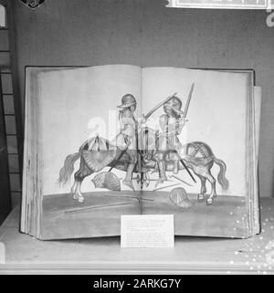 Exhibition of old books and engravings, in Arti et Amicitae, an old book depicting tournaments of knights Date: October 4, 1965 Keywords: books, engravings, knights, exhibitions Personal name: Arti et Amicitae Stock Photo