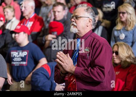 Wildwood, USA, 28th Jan 2020, Man holds hands together in prayer during opening of President Trump Rally, Photo Credit: Benjamin Clapp/Alamy Live News Stock Photo