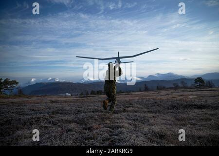 A U.S. Marine with Marine Rotational Force-Europe 20.1, Marine Forces Europe and Africa, launches a small unmanned aerial system in Setermoen, Norway, Oct. 10, 2019. MRF-E focuses on regional engagements throughout Europe by conducting various exercises, arctic cold-weather and mountain-warfare training, and military-to-military engagements, which enhance overall interoperability of the U.S. Marine Corps with allies and partners. (U.S. Marine Corps photo by Sergeant Justin X. Toledo) Stock Photo