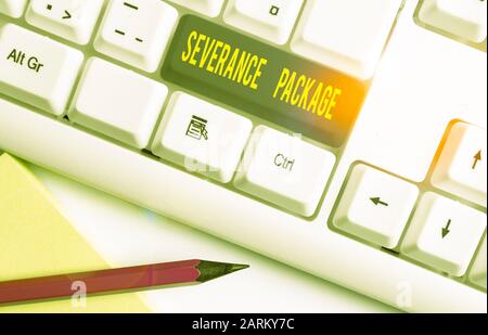Conceptual hand writing showing Severance Package. Concept meaning pay and benefits employees receive when leaving employment White pc keyboard with n Stock Photo