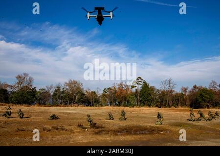 U.S. Marines with 1st Battalion, 25th Marine Regiment, currently assigned to 4th Marine Regiment, 3rd Marine Division, under the Unit Deployment Program, and Soldiers with 8th Infantry Regiment, Japan Ground Self-Defense Force, conduct an insert via MV-22B Osprey with Marine Medium Tiltrotor Squadron 262, during part of a comprehensive force on force event at Forest Light Middle Army in Aibano Training Area, Shiga, Japan, Dec. 10, 2019. Forest Light Middle Army is an annual training exercise that is designed to enhance the collective defense capabilities of the United States and Japan Alliance Stock Photo