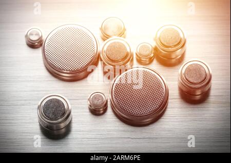 closeup button cell battery or watch battery or coin cell, used to power small electronics devices such as wrist watches or computer motherboard. Stock Photo