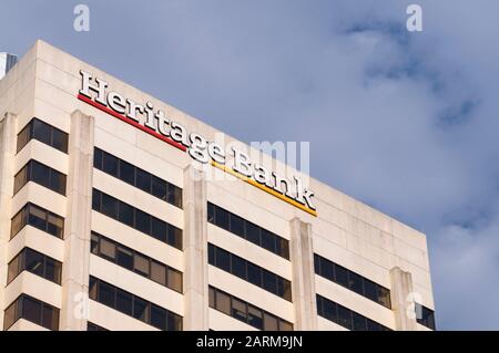 Brisbane, Queensland, Australia - 21st January 2020 : View of the Heritage Bank sign hanging on the roof of the Bank Building in Brisbane, Australia Stock Photo