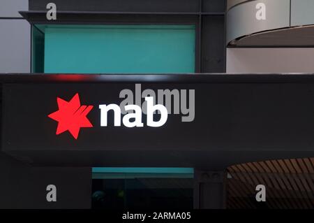Brisbane, Queensland, Australia - 21st January 2020 : View of an illuminated NAB (National Australian Bank) hanging in front of the entrance in Brisba Stock Photo