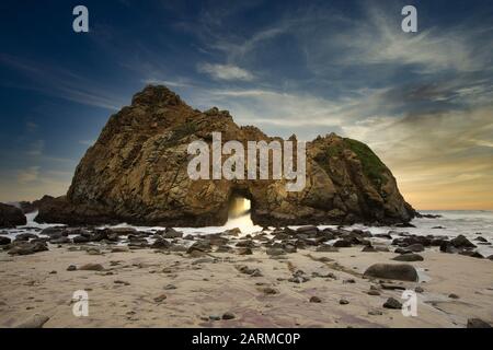 Coastal wonder of Keyhole Rock at Pfeiffer Beach, Big Sur #KeyholeRock #PfeifferBeach #BigSur Stock Photo