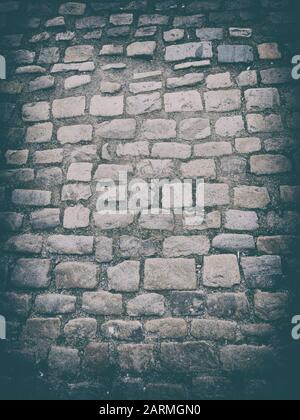 Black stone background paving blocks of different sizes in gray. It is natural background Stock Photo