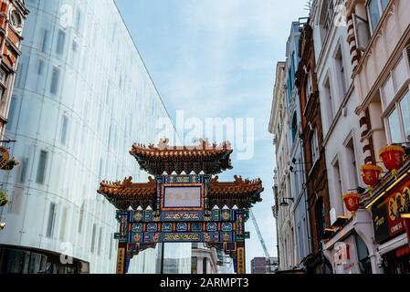 London, UK - May 15, 2019: View of the entrance to London Chinatown with Chinese restaurants, bakeries and souvenir shops in Soho area Stock Photo