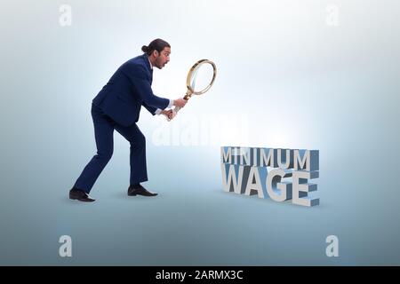 The concept of minimum wage with businessman Stock Photo