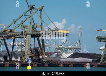 Netherlands, Rotterdam - July 30, 2019; Coal terminal wih big industrial cranes for handling coal transportation on the Maasvlakte in the port of Rott Stock Photo