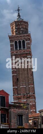 The leaning Tower of Chiesa di Santo Stefano (Church of St. Stephen) in Venice Stock Photo