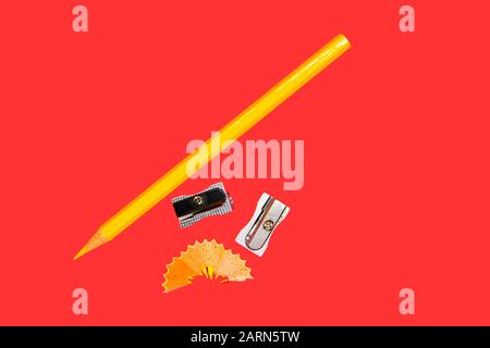 Pencil sharpener isolated on red background. Office supplies, back to school Stock Photo