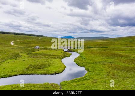 Aerial scenes from a holiday in a camping van traveling through the photogenic Scottish Highlands via the Isle of Skye and the North Coast 500. Stock Photo