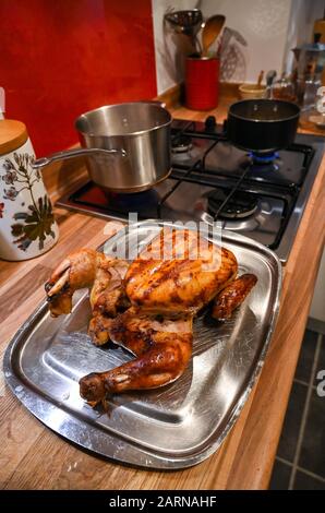 Roast chicken ready for carving for Sunday lunch Stock Photo