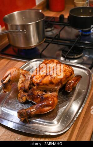 Roast chicken ready for carving for Sunday lunch Stock Photo