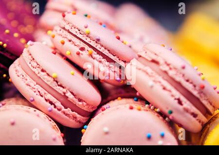 Delicious and beautiful pink, macaroons on sale. Close up. square format Stock Photo