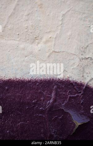 The texture of the plaster wall with the color of beige and cherry color. Background. Stock Photo