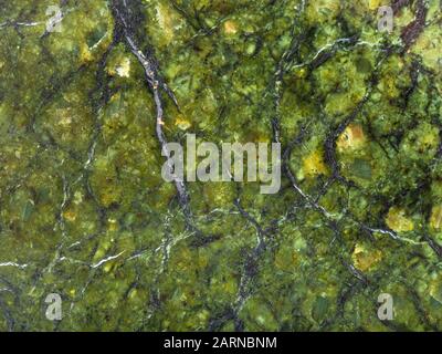 background from polished natural serpentinite rock close up Stock Photo