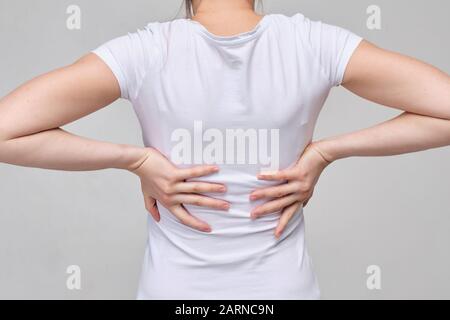 A Girl in a White T-shirt Massages the Groin. Gynecology Problems Stock  Photo - Image of background, girl: 172264378