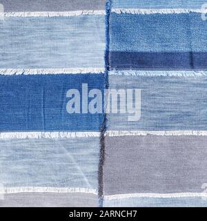textile square background - patchwork from various denim flaps Stock Photo
