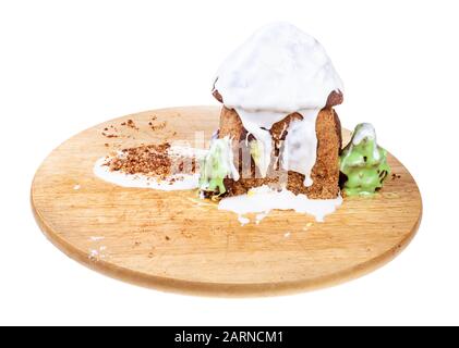 handmade Gingerbread house on wooden board isolated on white background Stock Photo