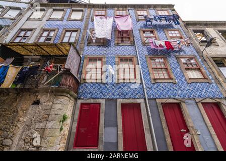 Old residential building with Azulejo facades in Ribeira District of Porto city, Portugal Stock Photo