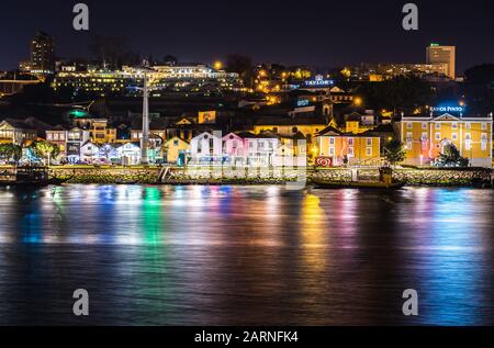 Port Wine cellars over Vila Nova de Gaia city embankment seen from Porto city in Portugal Stock Photo