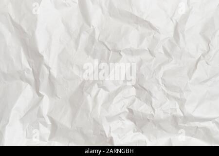 The background and texture of white crumpled paper. Top view. Stock Photo