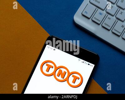 In this photo illustration the TNT Express logo is seen displayed on a smartphone Stock Photo