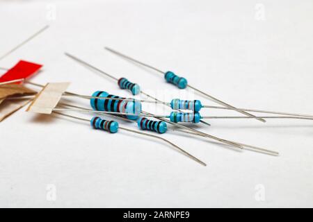 Heap of blue resistors close up on white background Stock Photo