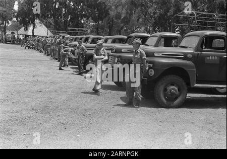 Transfer of Ngandyuk  Saturday 12 November were at Ngandyuk (East Java) 48 Ford trucks, 16 motorcycles, 4 jeeps, 4 pick-ups and 3 cross cars to the TNI transferred. At Ngandjoek the cars were inspected for the surrender [the Dutch drivers are in charge of their vehicles] Date: 12 November 1949 Location: Indonesia, Java, Dutch East Indies, Ngandjoek Stock Photo