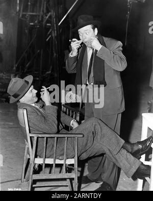 JOSEPH COTTEN as Holly Martins and ORSON WELLES as Harry Lime on set candid during filming at London Film Studios Shepperton England of THE THIRD MAN 1949 director CAROL REED screenplay GRAHAM GREENE producer ALEXANDER KORDA London Film Productions / British Lion Film Corporation Stock Photo